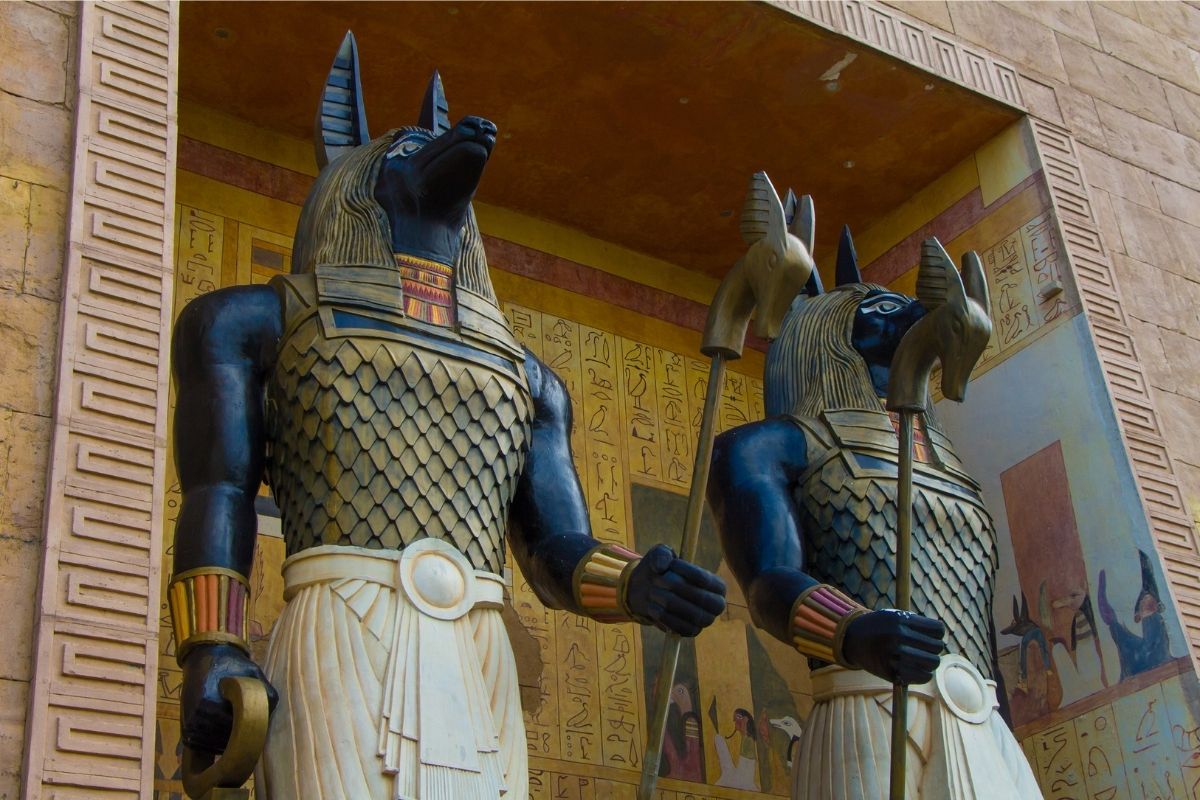 Ancient Egyptian god Anubis depicted with a jackal head, symbolizing his role as protector of the dead and guardian of tombs.